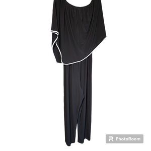 One Piece pant suit with asymmetrical hem scarf top.  Polyester/spandex